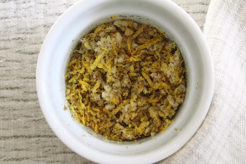 Lemon zest and spices for The Best Oven Roasted Carrots with Lemon and Thyme mixed together in a small bowl.