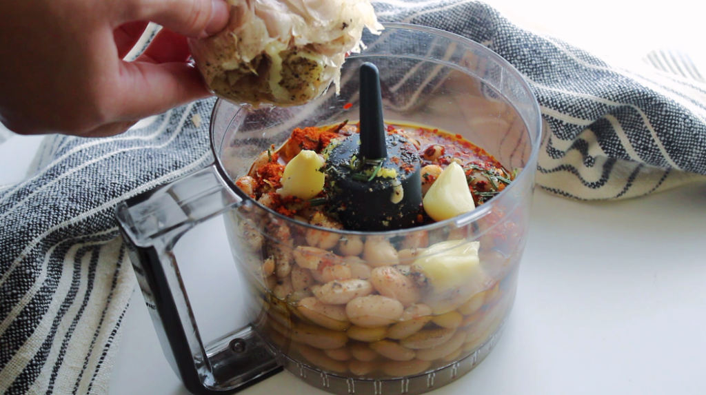 Roasted garlic mixed in with spicy white bean dip ingredients.