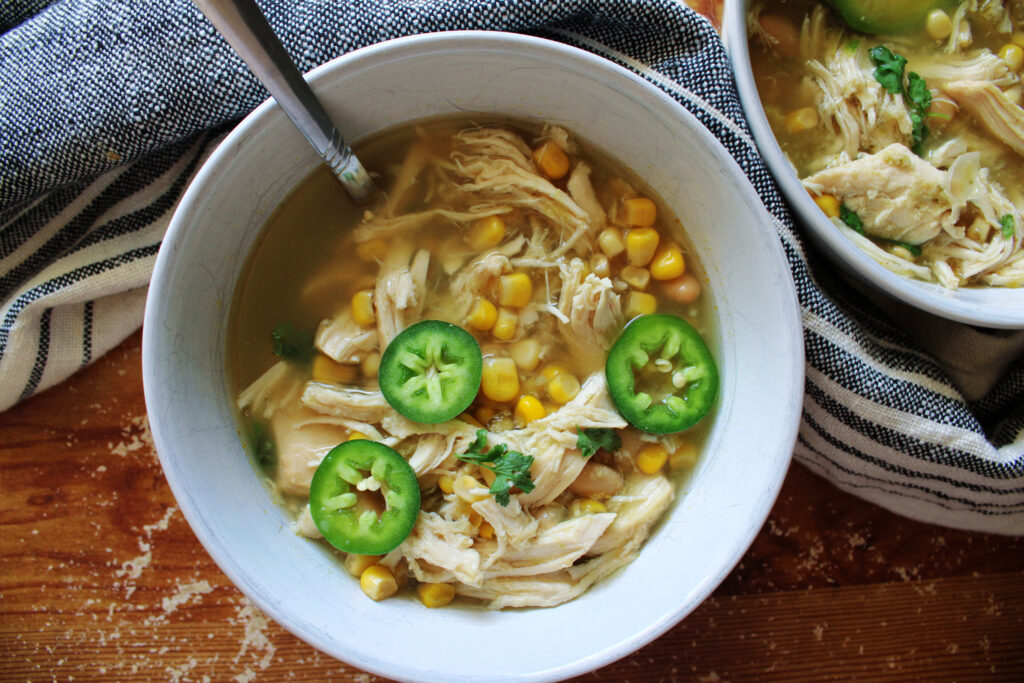 Slow Cooker white chicken chili in a white bowl.