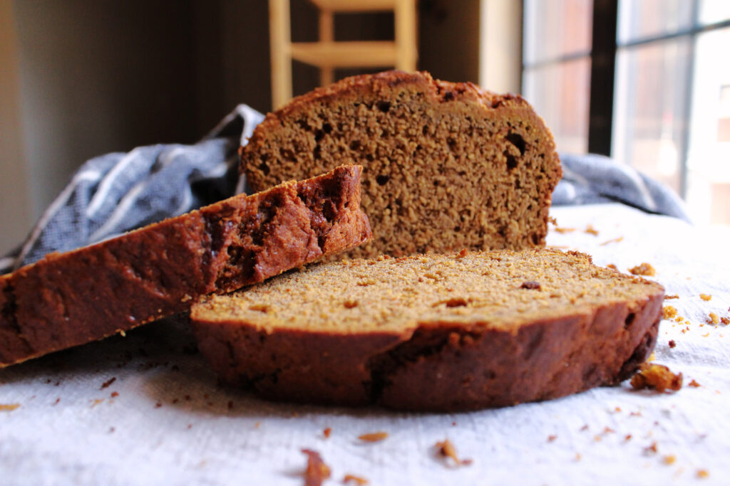 Pumpkin cinnamon sourdough bread on a tea towel.