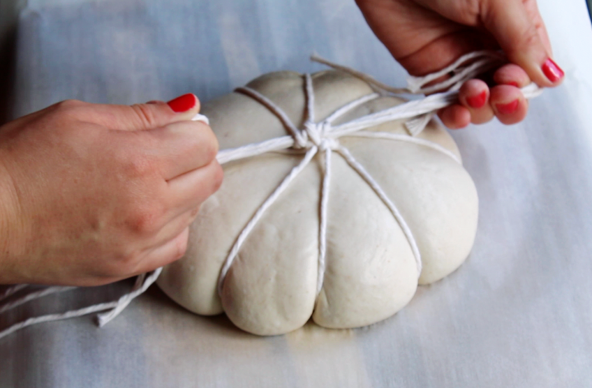 Fine tie of twine for the pumpkin shaped sourdough loaf for fall