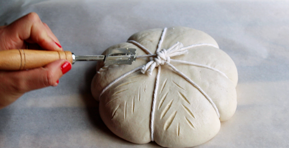 Pumpkin shaped sourdough loaf for fall final scoring
