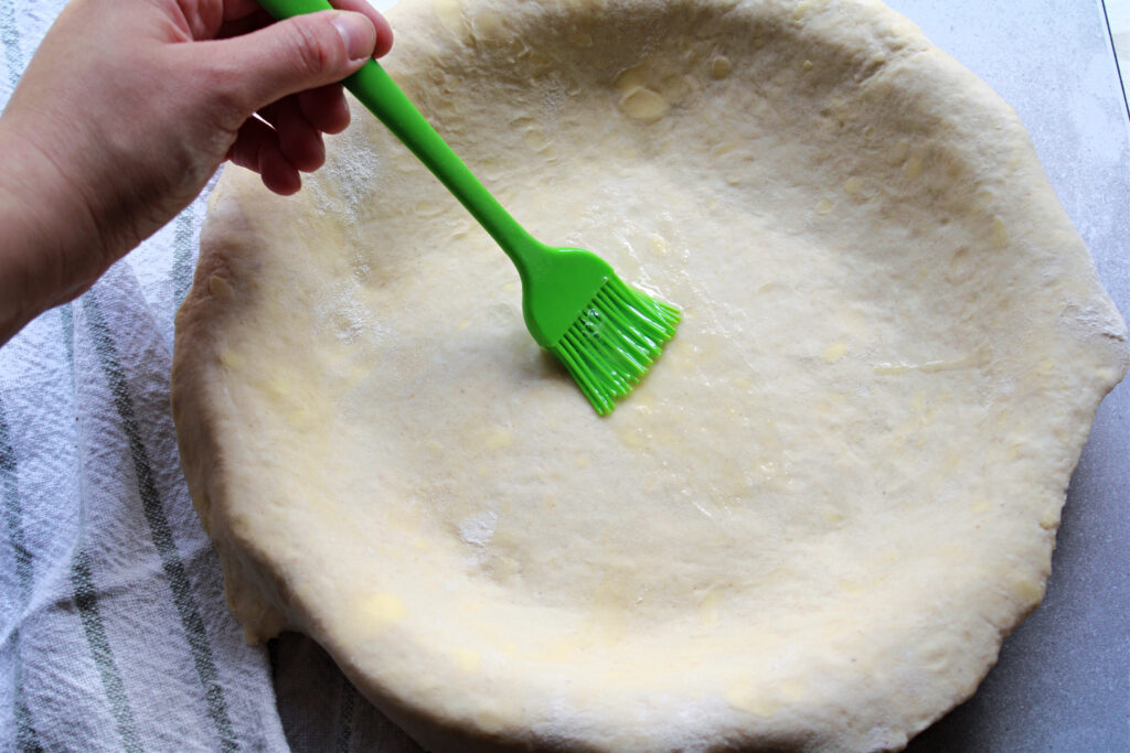 pear and ginger galette pie crust with brushed on egg wash.