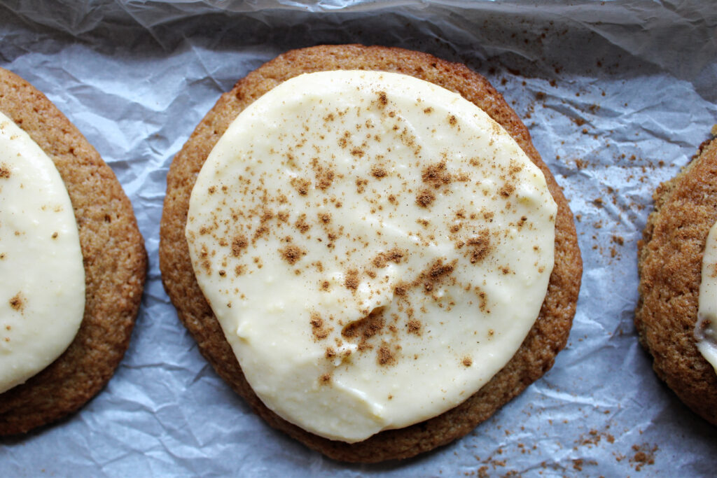 Sourdough discard pumpkin spice cookies on parchment paper.