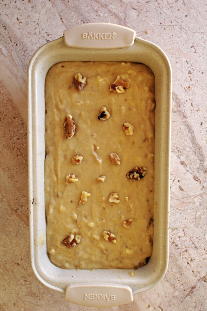 Banana bread batter in a loaf pan