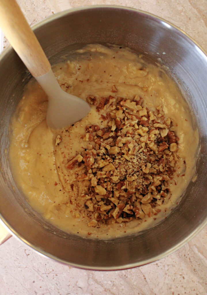 Banana bread batter with walnuts.