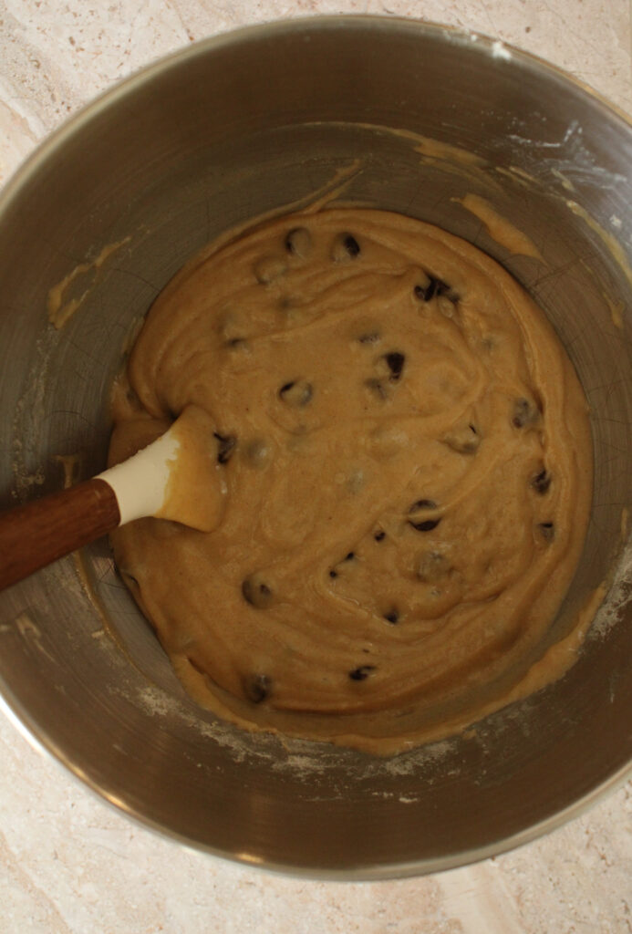 Chocolate chips mixed in with sourdough muffin ingredients.