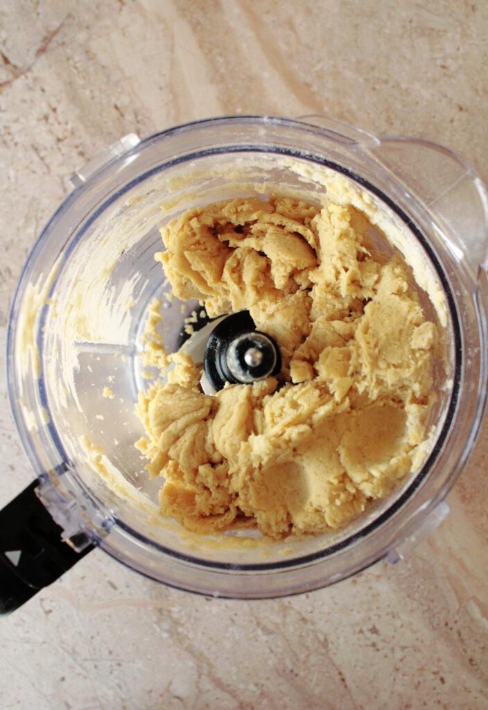 Sourdough chocolate chip scone dough mixed together in a food processor.