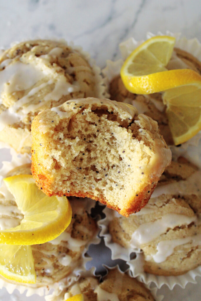 lemon poppy seed muffins stacked on the counter.