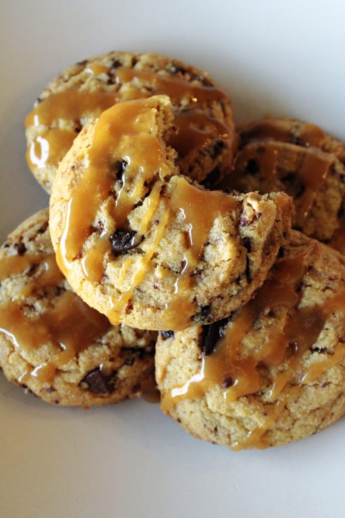 Salted caramel peanut butter cup cookies on a plate.