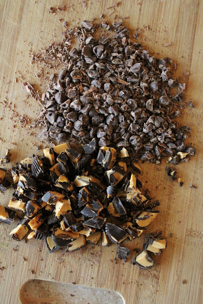 Chopped chocolate chips and peanut butter cups for the Salted caramel peanut butter cup cookies.