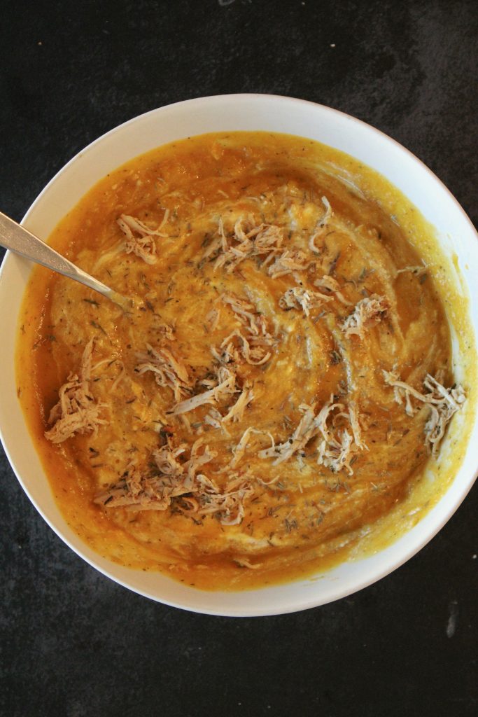 Butternut squash and chicken soup in a bowl.