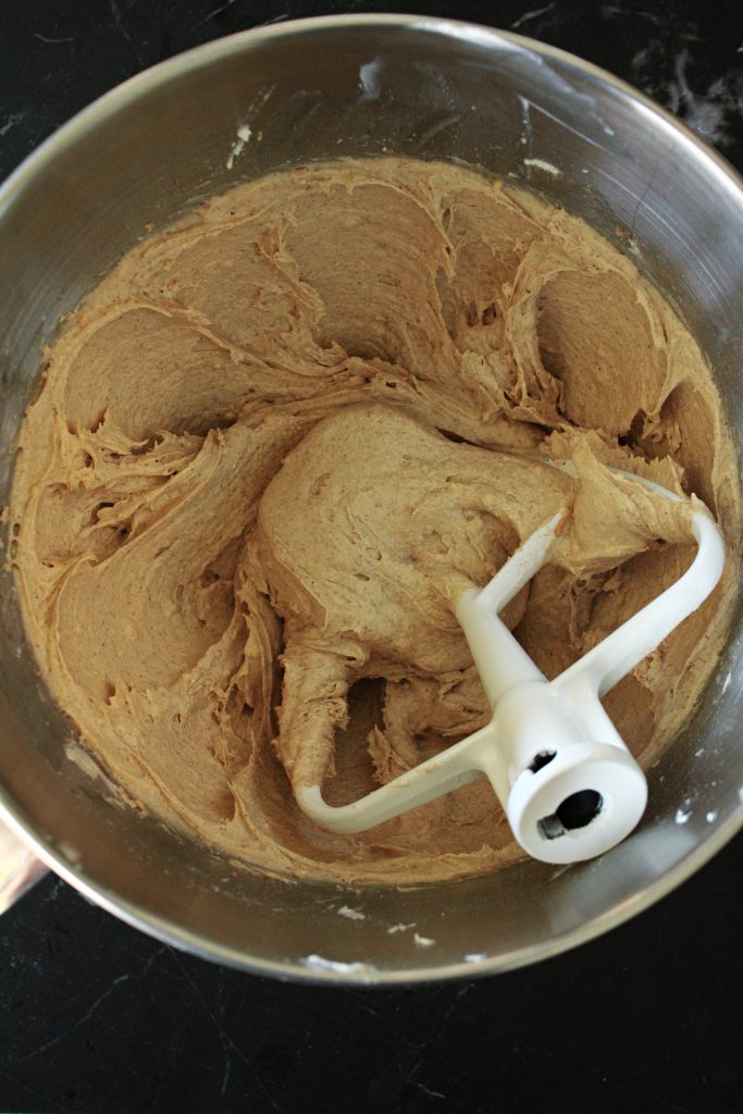 Wet and dry ingredients whipped together in a mixing bowl for the Cinnamon Cupcakes with Cookie Butter Frosting.