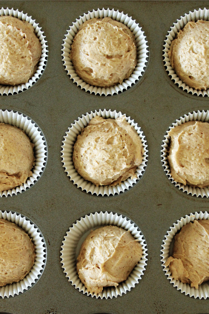 Cinnamon Cupcake batter inside muffin tins ready to bake.