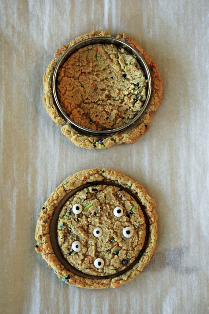 Baked cookies that are cut out with a biscuit cutter for the Halloween Monster Ice Cream Sandwiches.