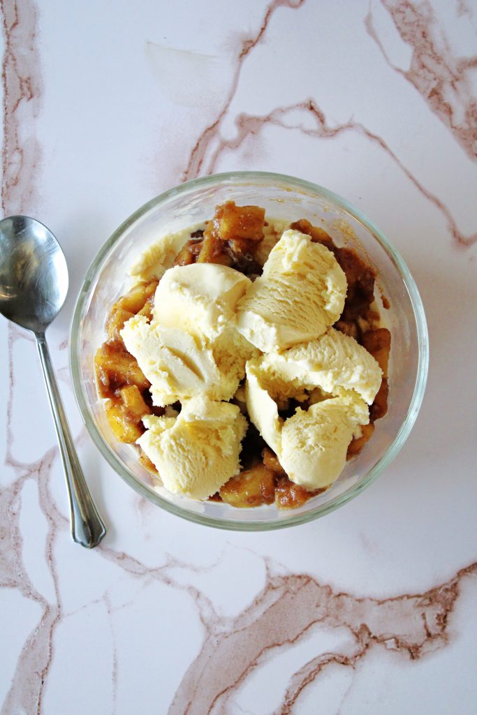 The best apple pie ice cream in a bowl on the counter.